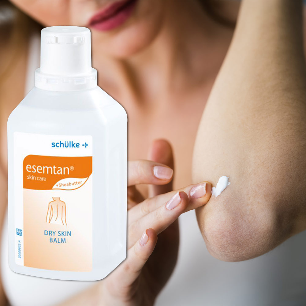 Schülke esemtan® Dry Skin Balm Körperlotion, weiße Flasche und Creme auf der Haut